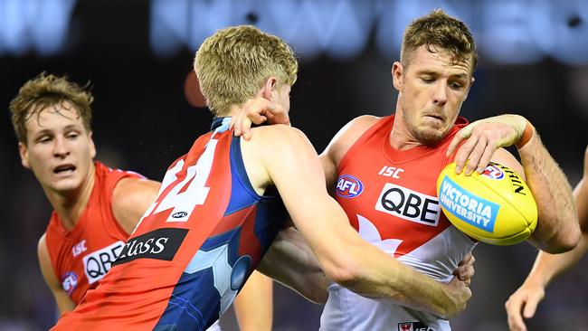 Luke Parker is wrapped up by Tim English during Sydney’s Round 1 loss to Western Bulldogs. Picture: Quinn Rooney/Getty Images. 