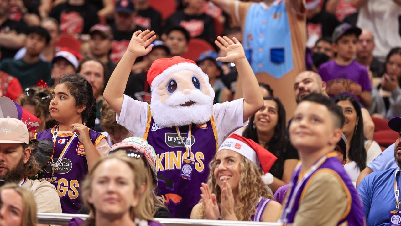 A Kings fan in a Santa hat gets the approval from the big crowd attending the inaugural Christmas Day clash. Picture: Jenny Evans/Getty Images