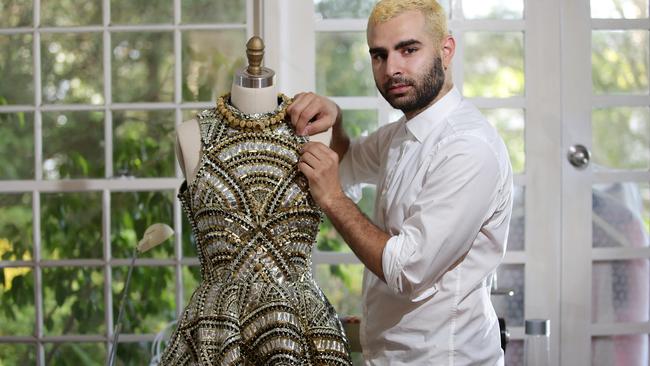 Young emerging fashion designer Yousef Akbar pictured at his studio at home in West Pymble. Picture: Supplied.