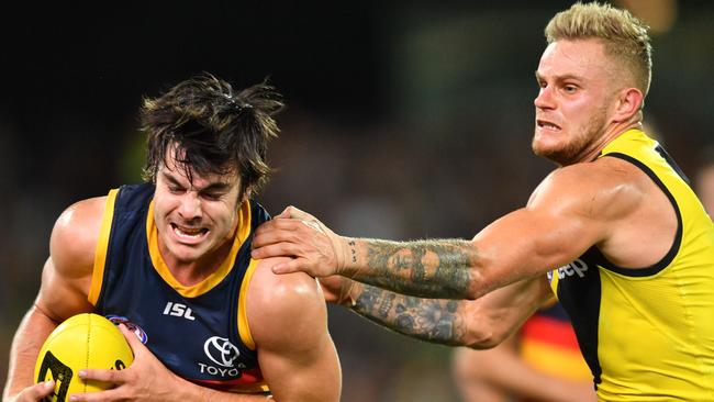 Adelaide’s Darcy Fogarty is tackled by Richmond’s Brandon Ellis during the Round 2 AFL match at Adelaide Oval. Picture: AAP