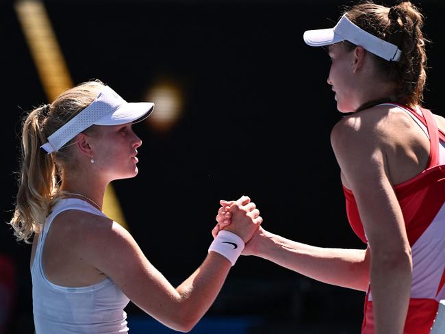 Kazakhstan's Elena Rybakina (R) and Australia's Emerson Jones shake hands after Rybakina's victory in their women's singles match on day three of the Australian Open tennis tournament in Melbourne on January 14, 2025. (Photo by WILLIAM WEST / AFP) / -- IMAGE RESTRICTED TO EDITORIAL USE - STRICTLY NO COMMERCIAL USE --