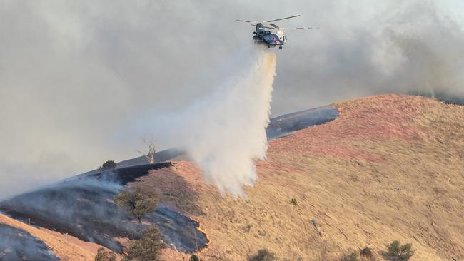 A waterbombing aircraft responding to the fire. Picture: Jason Edwards