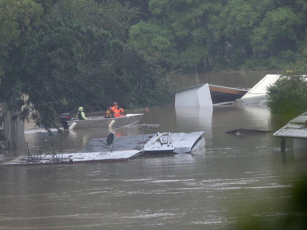 Debris floats in the floodwaters of the Hawkesbury River in Sackville, NSW. Picture: NCA NewsWire / Jeremy Piper