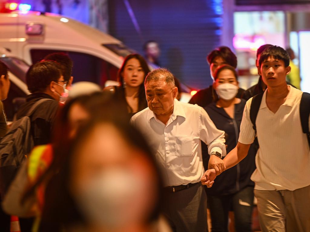 People leave the Siam Paragon mall after the shooting. Picture: Sirachai Arunrugstichai/Getty Images