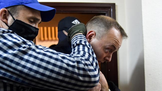 Ivan Safronov, a former journalist and aide to the head of Russia's space agency Roscosmos, is escorted inside a court building after being detained on charges of treason for divulging state military secrets, Moscow, July 7, 2020. Picture: Vasily Maximov/AFP
