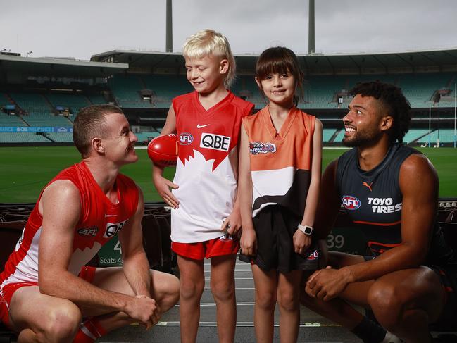 DAILY TELEGRAPH - 28.4.24MUST CHECK WITH PIC EDITOR BEOFRE USE - AFL fans Beau Yandell (2nd from left) and Alina Stephenson (2nd from right) pictured with Sydney Swans player Chad Warner (left) and GWS player Connor Idun (right) before the local derby on the weekend. Picture: Sam Ruttyn