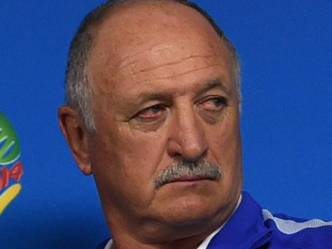 Brazil's coach Luiz Felipe Scolari leaves after a press conference in SaoFBL-WC-2014-BRA-PRESSER Paulo, Brazil on June 11, 2014 on the eve of the opening match of the 2014 FIFA World Cup between Brazil and Croatia. AFP PHOTO / PEDRO UGARTE