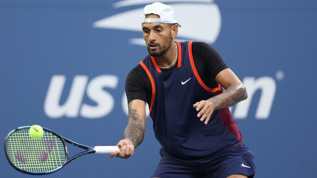 Nick Kyrgios of Australia plays a forehand against Benjamin Bonzi