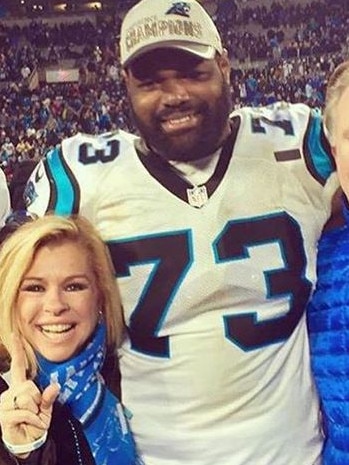 Oher with Leigh Anne Touhy.