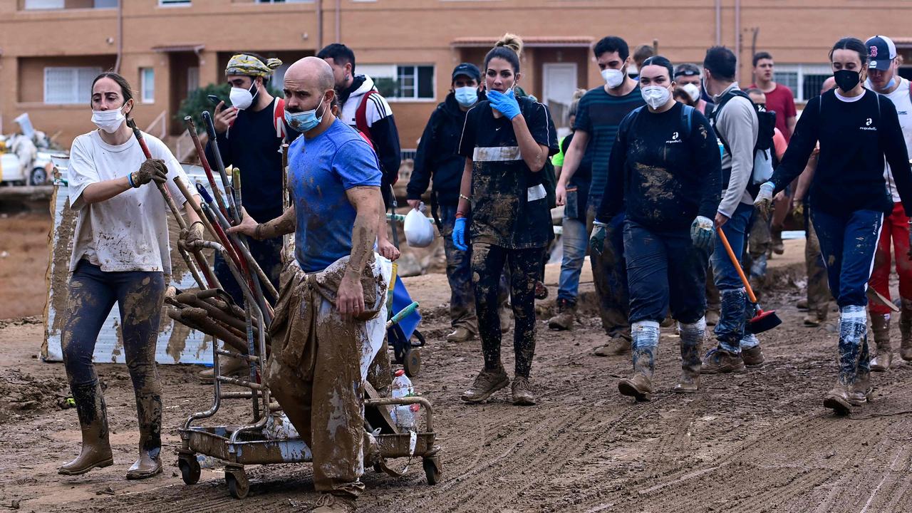 Volunteers leave Paiporta on November 3, after a day spent assisting the vast clean up operation. Picture: Jose Jordan/AFP