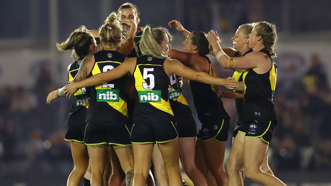 Richmond players celebrate their first goal in AFLW during the final quarter of Friday night’s season opener against Carlton. Picture: Getty Images