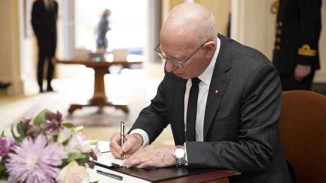 His Excellency General the Honourable David Hurley AC DSC (Retd), Governor-General of the Commonwealth of Australia, signs the Condolence Book for Her Majesty Queen Elizabeth II at Government House. Picture: Government House via NCA NewsWire