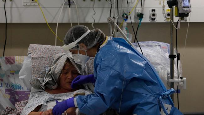 An Israeli medic tends to a Covid-19 patient inside an isolation ward at the Ziv Medical Centre in Safed this week. Picture: AFP