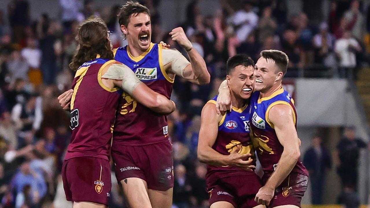 Brisbane players celebrate after knocking Richmond out of the finals race. Picture: Russell Freeman/AFL Photos via Getty Images