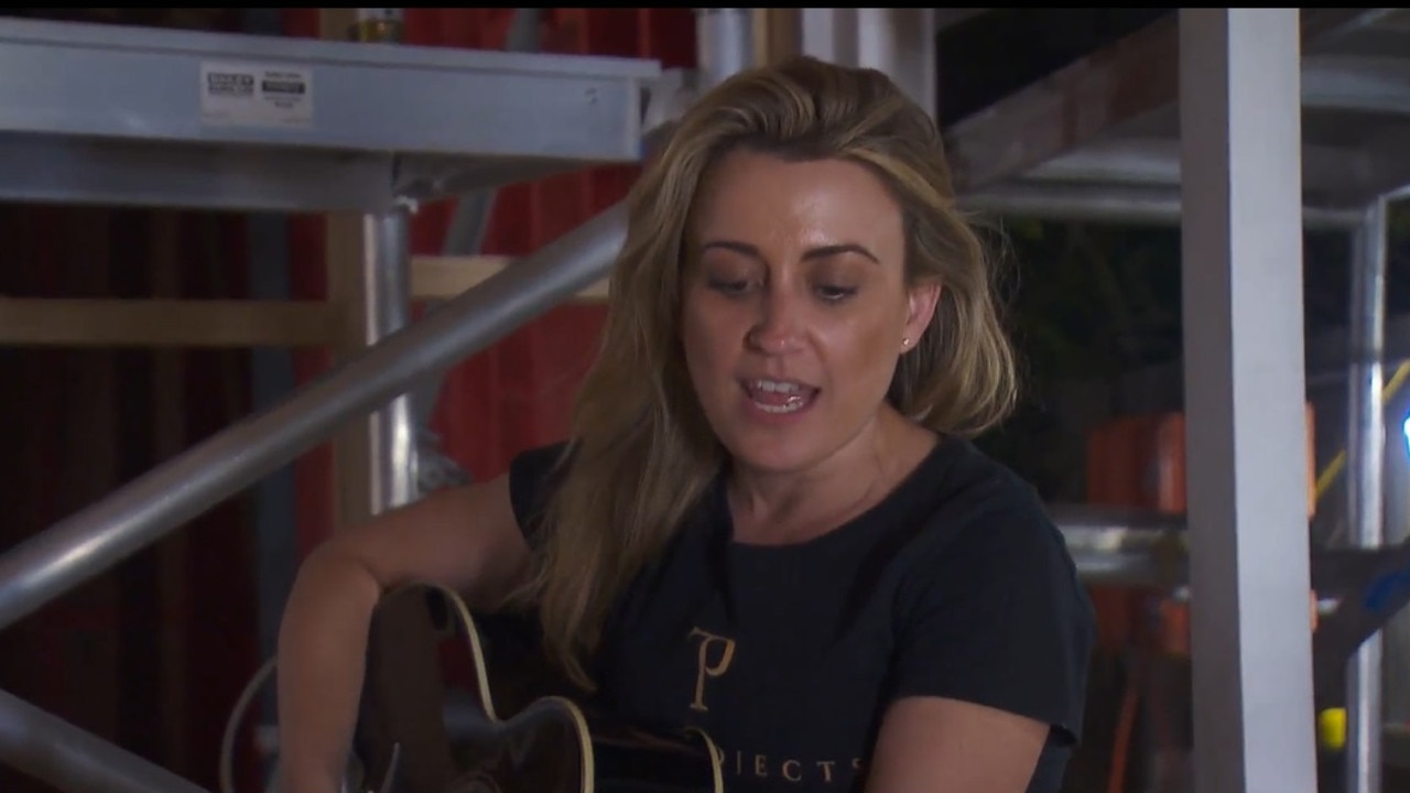 Kirsty takes some time out with her guitar to croon some Dolly Parton hits. Picture: Supplied, Channel 9