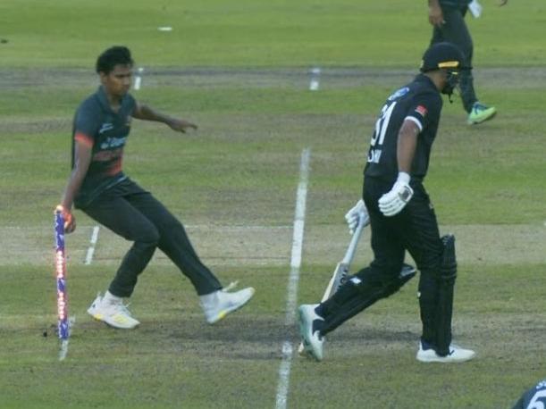 Bangladesh's Hasan Mahmud runs out New Zealand's Ish Sodhi at the non-striker's end.