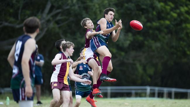 The boys fly between Sandgate District SHS vs Pacific Pines SHS. Picture: REnae Droop