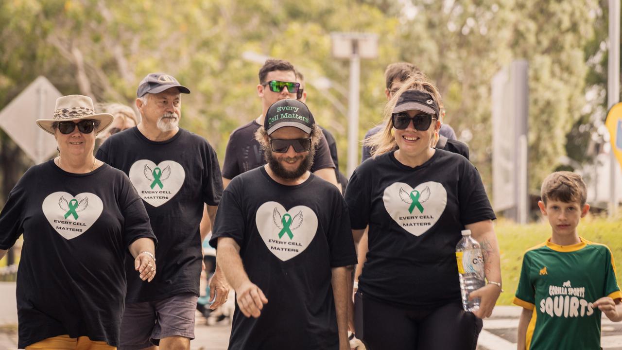 Ms Spencer and her partner Grant lead a march to Plantation Park in Ayr.