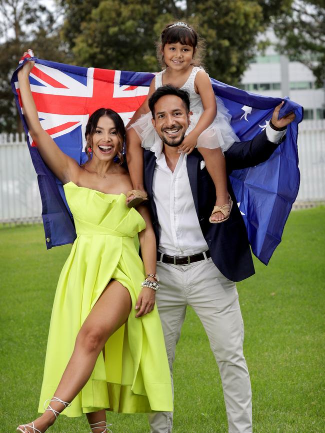 Colombian family Carlos Varela and Andrea Sanson with their daughter Amilia became Australian citizens on Wednesday. Picture: Toby Zerna