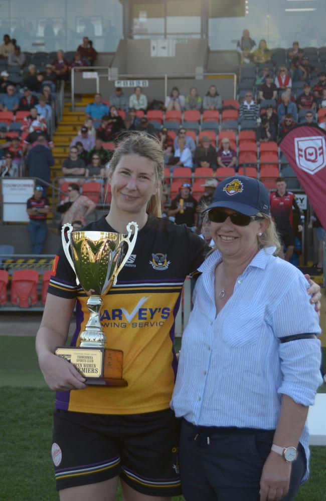 Gatton Hawks women's captain Kimberley Dore receives the trophy.