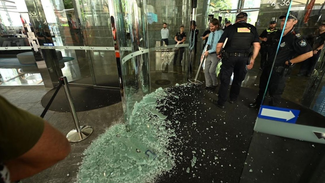 A glass door has been smashed during a union protest in Brisbane's CBD. Picture: Lyndon Mechielsen