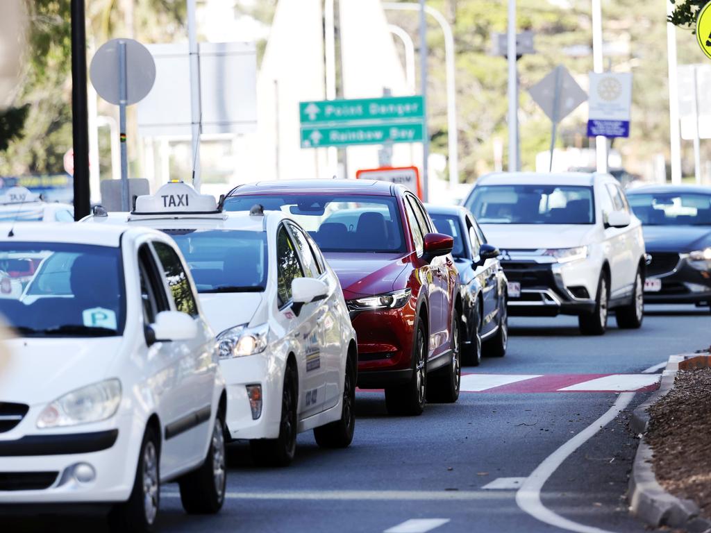 Cars line up at the border between NSW and Queensland. Picture: Nigel Hallett