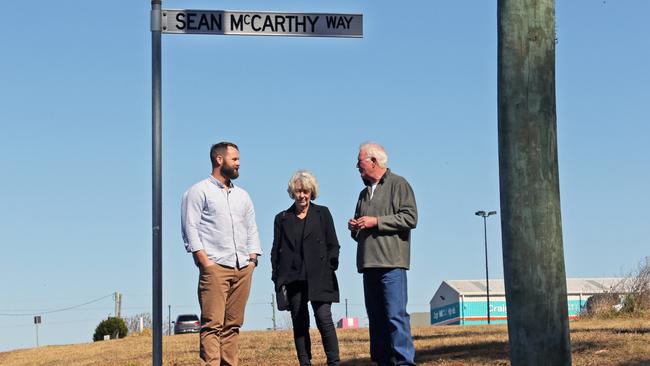 Sean McCarthy's parents Mary and David with Johnathan on a local street named after Sean. Picture: Gary Ramage