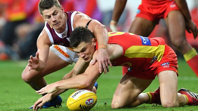 Lions star Dayne Zorko competes with Sun Ben Ainsworth in the Q Clash. Picture: AAP Image/Darren England