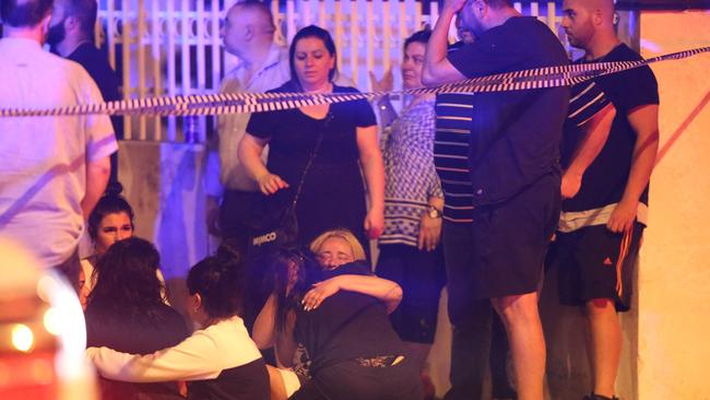 Mourners on the scenes in Dalton Rd Epping where Nabil Maghnie was gunned down. Picture: Wayne Taylor