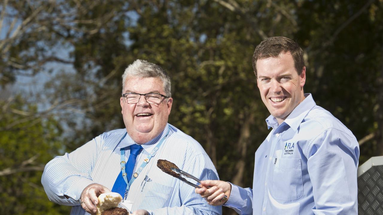 Derek Tuffield (left) of Lifeline and Bruce McConnel of Food Leaders Australia with some of the Angus beef patties donated by NH Foods Oakey for distribution by Lifeline, Thursday, September 13, 2018.