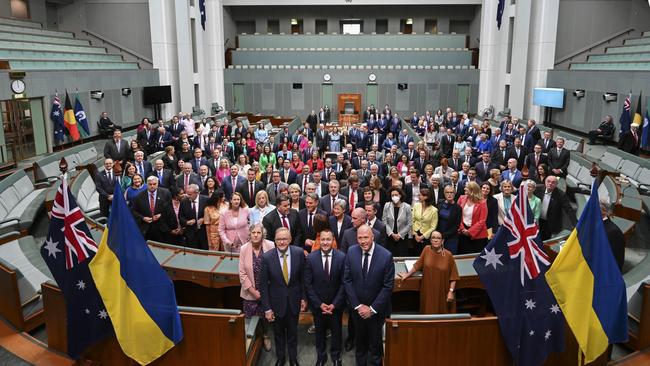 Ambassador of Ukraine to Australia, Vasyl Myroshnychenko, poses for a group photo with senators and MPs on the floor of the House to demonstrate the Australian Parliament's solidarity with the people of Ukraine.