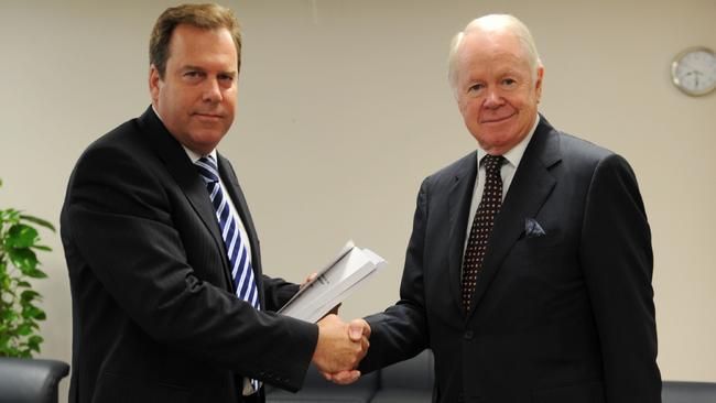 John Clarke QC delivers the 'Report of the Inquiry into the Case of Dr. Muhamed Haneef' to Federal Attorney-General Robert McClelland.