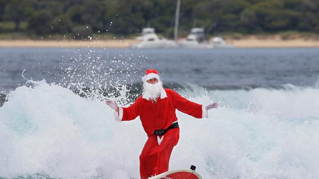 Surfing Santa will be coming to the Harbourside Markets with his Kombi this Sunday. Picture: Toby Zerna