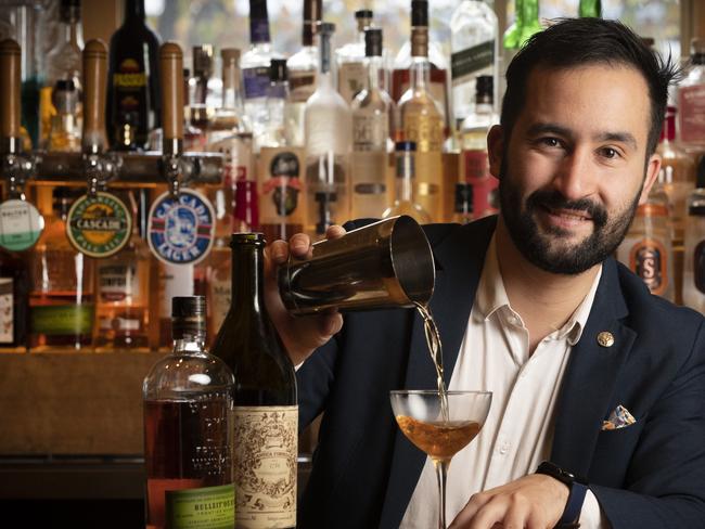 Mateo Ortiz makes a Manhattan at The Den Salamanca.  Picture: Chris Kidd