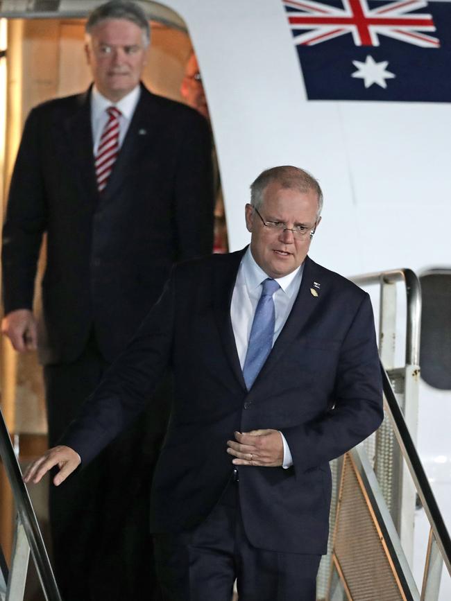 Australia's Prime Minister Scott Morrison (bottom) has made 13 overseas trips. Picture: AFP