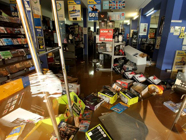 Water and mud in the Beta Electrical store in Woodlark St. Picture: Nathan Edwards