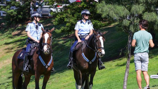 Police at Bondi Beach telling any locals sitting on the grass or benches to move long. Picture: Gaye Gerard