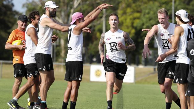 Hartlett running through a guard of honour at December’s pre-season camp. Picture: Sarah Reed