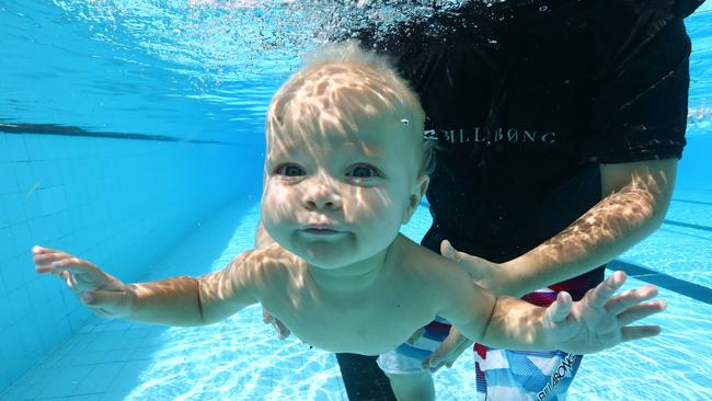 Sam Bradshaw and son Spencer, 1, from Mermaid Waters, having some fun at Miami Aquatic Centre. Picture: Adam Head