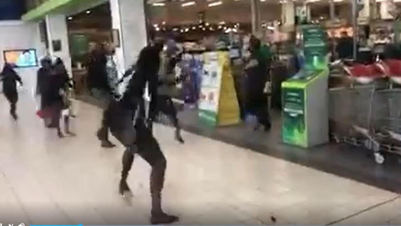 Footage from a knife fight outside the Darwin CBD Woolworths.