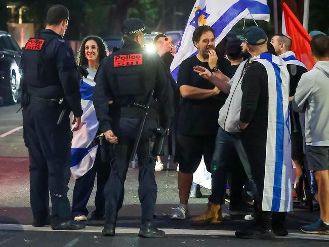 People waved Israeli flags outside the Caulfield Hebrew Congregation synagogue. Picture: Ian Currie