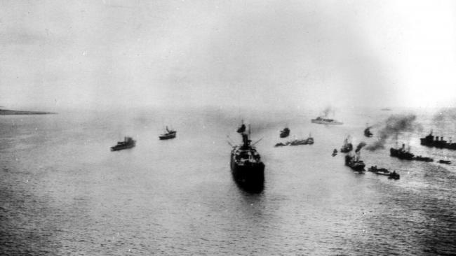 Trawlers carry troops away from Gallipoli.