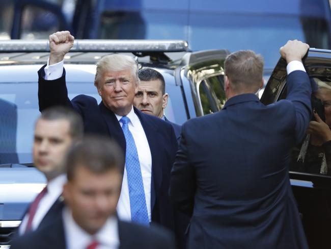 Trump struck a confident pose early on in election day. Picture: Aaron P. Bernstein/Getty Images/AFP