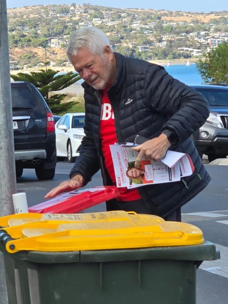 Video has emerged of a Labor volunteer ripping down an election poster at a Boothby polling booth. Picture: Supplied