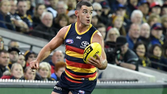 Adelaide captain Taylor Walker in action against Gold Coast.