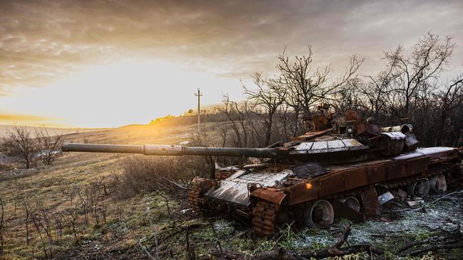 A destroyed T-72 Russian tank in the village of Bohorodychne, eastern Ukraine. The war of attrition between Russia and Ukraine is now morphing into a rearmament race between Moscow and European members of NATO. Picture: AFP