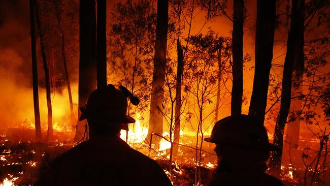 Firefighters monitor fires in East Gipplsland. Picture: Darrian Traynor/Getty Images