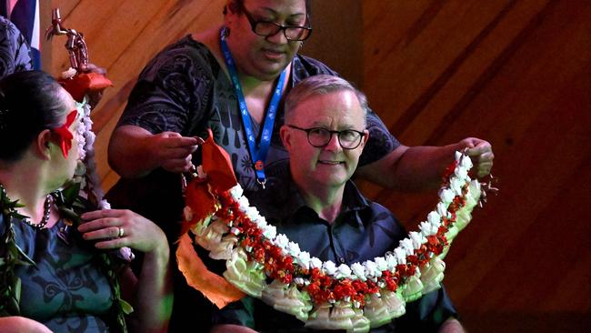 Anthony Albanese receives a garland at the Pacific Islands Forum in Suva, Fiji, in July 2022. The Prime Minister will face pressure at next week’s forum to take stronger action on climate change. Picture: AFP