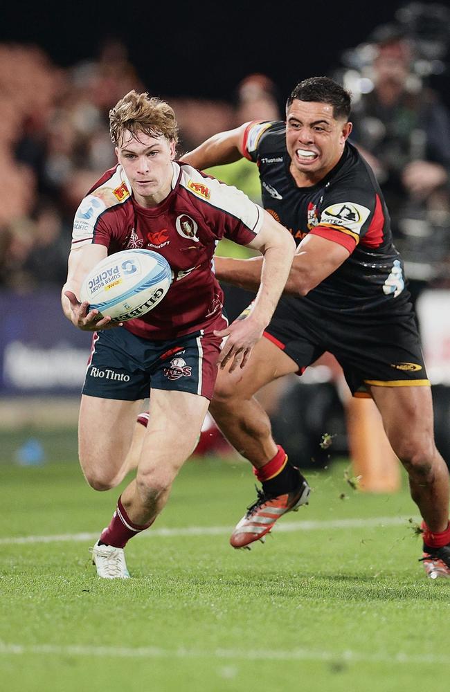 Chiefs' Anton Lienert-Brown (R) chases Reds' Tim Ryan during the Super Rugby Pacific quarterfinal match between Waikato Chiefs and Queensland Reds at Waikato Stadium in Hamilton on June 7, 2024. Photo by DAVID ROWLAND / AFP