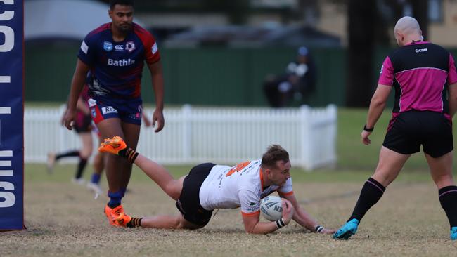 The Oaks Tigers Mitch Brasington scores his second try against Campbelltown Collegians. Picture: Steve Montgomery